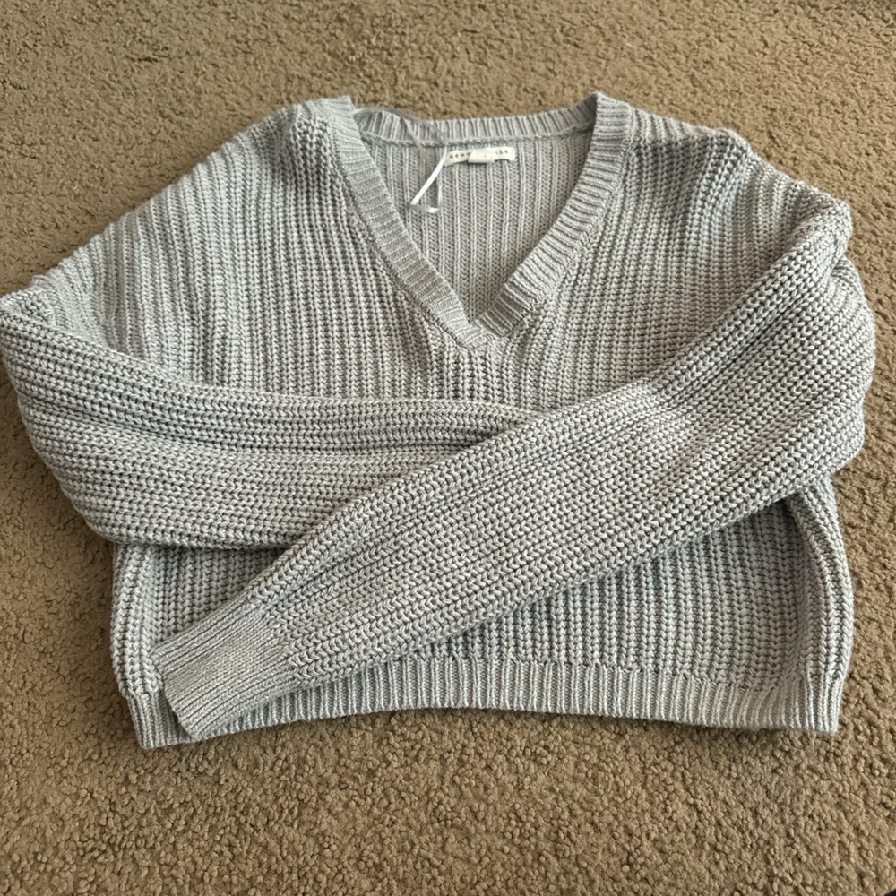 Two cropped sweaters